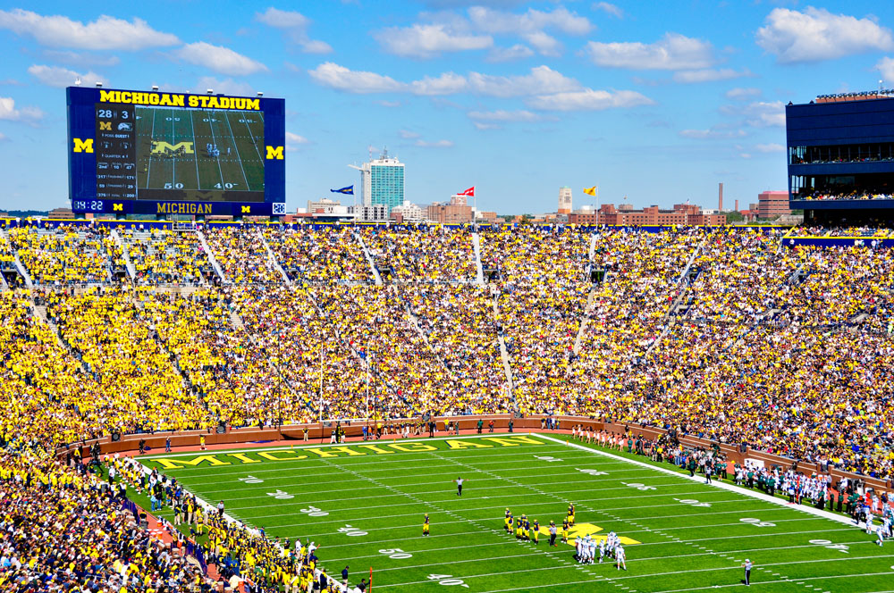 An overhead shot of a football game at the Michigan Stadium.