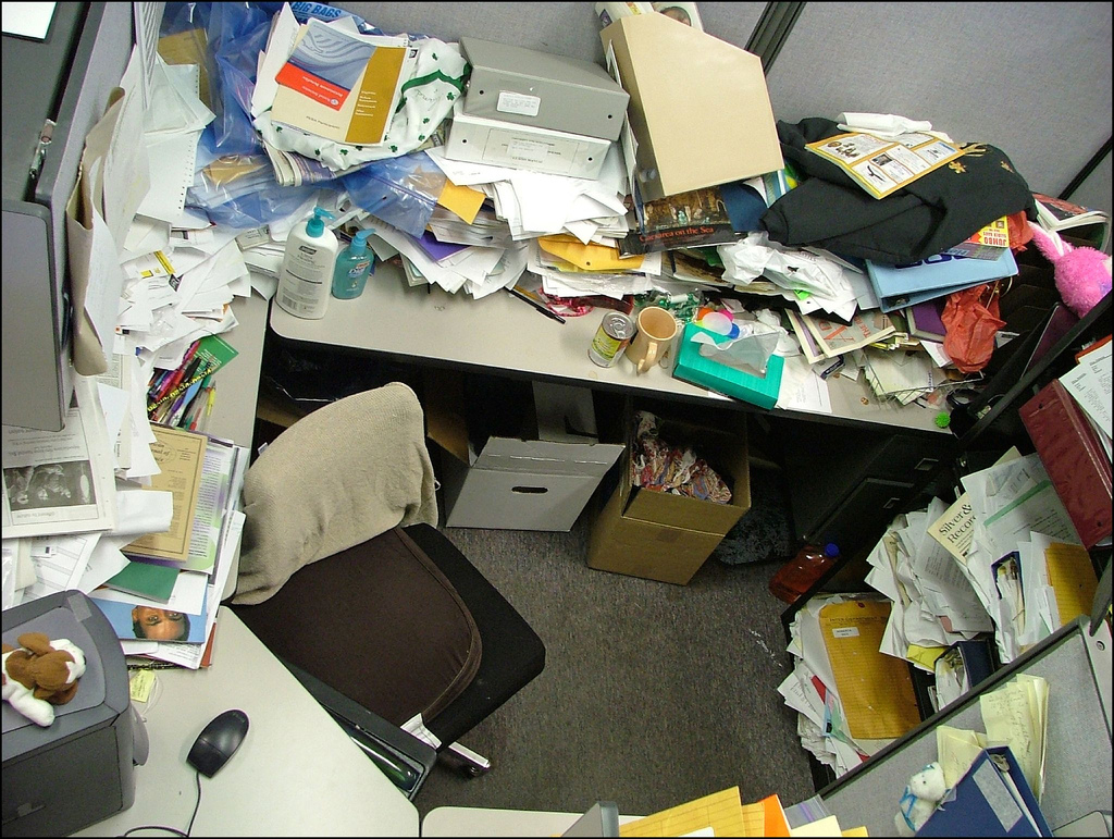 A messy office space without any organization and management system.