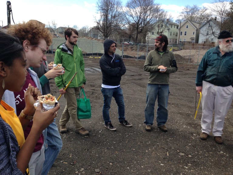 Several volunteers gathering in a New Haven park to work on fixing small damages and other requests.